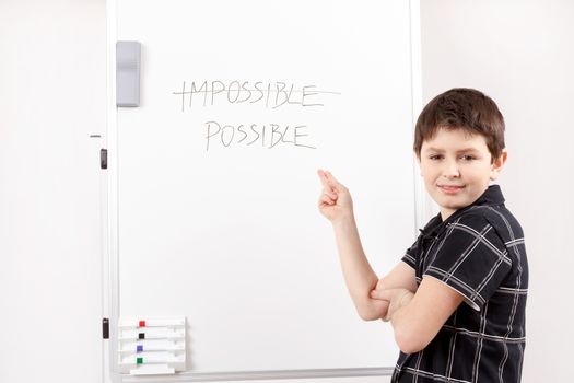 little boy with white board showing paragraphs in word impossible