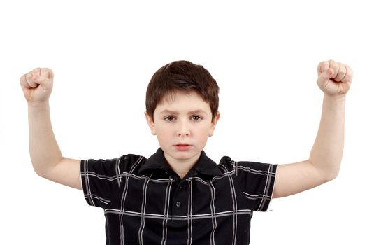 Portrait of a young boy with hand raised up against white background 