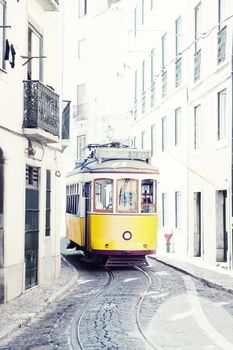 yellow ancient tram on streets of Lisbon, Portugal