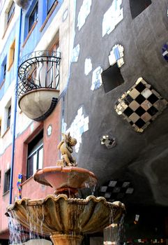 Fountain detail outside Hundertwasser house in Vienna (Famous landmark), Austria 