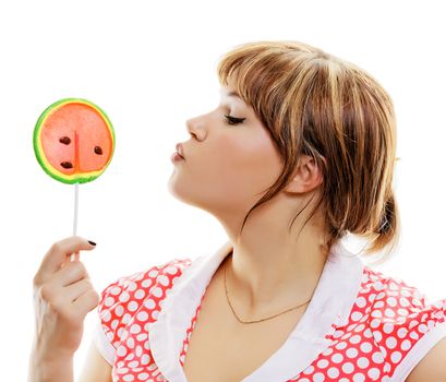 attractive girl with a round lollipop on a white background