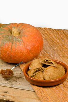 Traditional homemade pumpkin biscuits on a wooden table