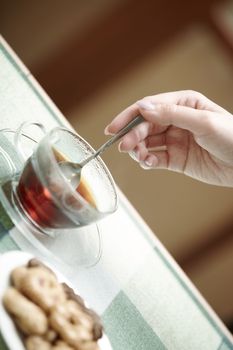 Human hands making tea