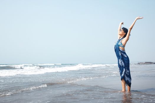 Happy woman at the sea during vacation