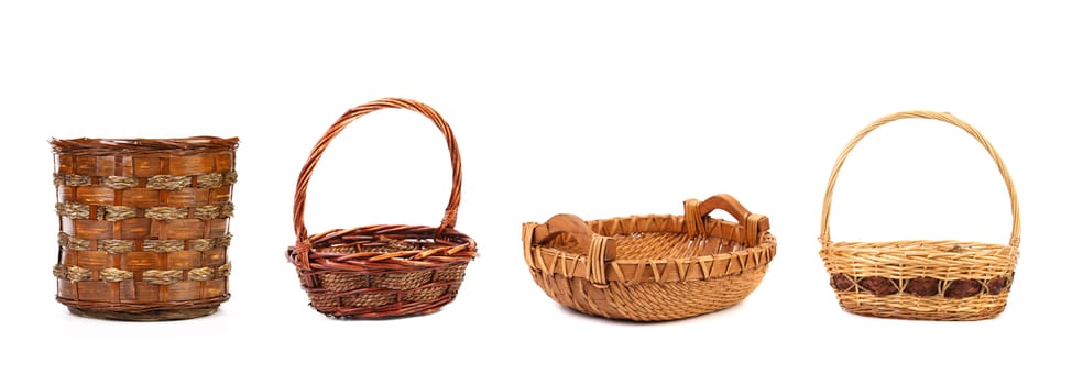 Four different wicker vases and baskets. Isolated on a white background.