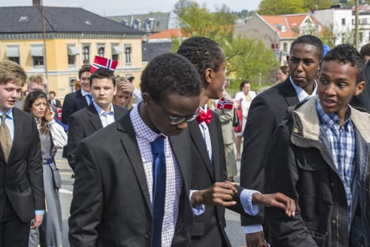 Norwegian Constitution Day is the National Day of Norway and is an official national holiday observed on May 17 each year. This day is also often called the Children's Day. The picture is shot in the center of Halden City.
