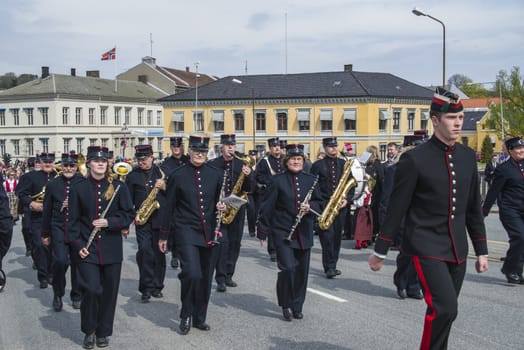 Norwegian Constitution Day is the National Day of Norway and is an official national holiday observed on May 17 each year. This day is also often called the Children's Day. The picture is shot in the center of Halden City.