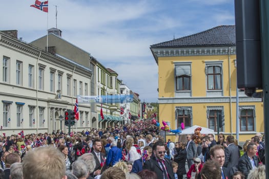 Norwegian Constitution Day is the National Day of Norway and is an official national holiday observed on May 17 each year. This day is also often called the Children's Day. The picture is shot in the center of Halden City.