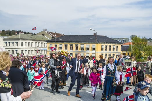Norwegian Constitution Day is the National Day of Norway and is an official national holiday observed on May 17 each year. This day is also often called the Children's Day. The picture is shot in the center of Halden City.