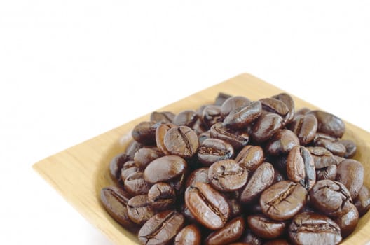 Coffee beans with wooden cup isolated on white background