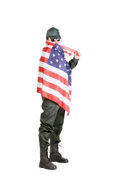 Man in workwear stands with american flag. Isolated on a white background.