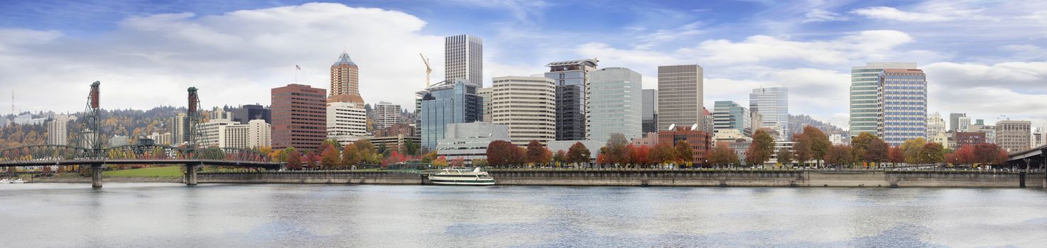 Portland Oregon Downtown City Waterfront Skyline Along Willamette River with Blue Sky and White Clouds in Fall Season Panorama