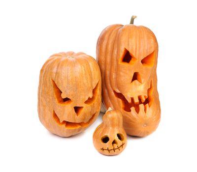 Three spooky halloween pumpkin lantern. Isolated on a white backgropund.