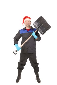 Worker in santa hat with shovel. Isolated on a white backgropund.