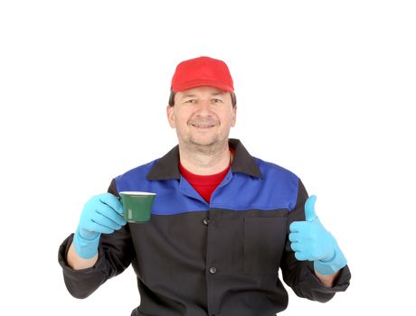 Man in workwear with a cup in hand. Isolated on a white background