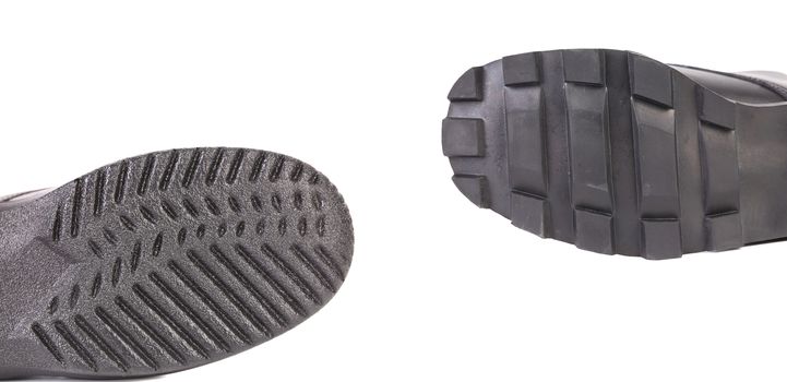 Black shoe soles. There is white space for text