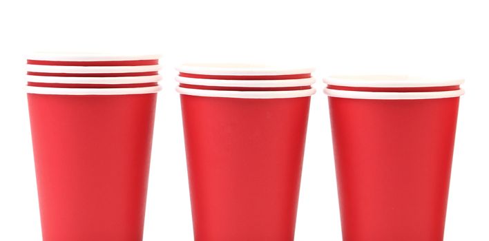 Three red paper cups. Isolated. On a white background