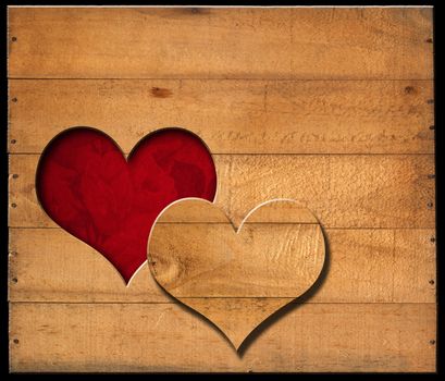 Brown wooden wall with a hole in the shape of heart and red velvet background with roses flowers