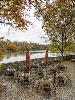 Abandoned chairs of a restaurant in the fall