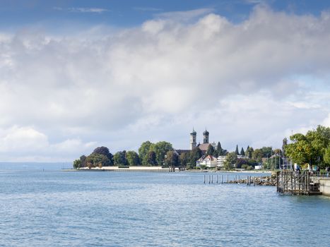 View to the lake Bodensee in the German town Friedrichshafen with the curch Schlosskirche in background on a sunny day