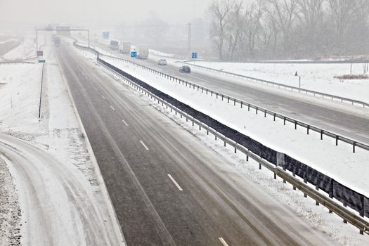 Highway traffic in heavy snowfall