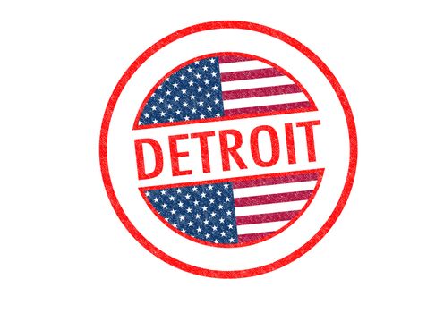 Passport-style DETROIT rubber stamp over a white background.