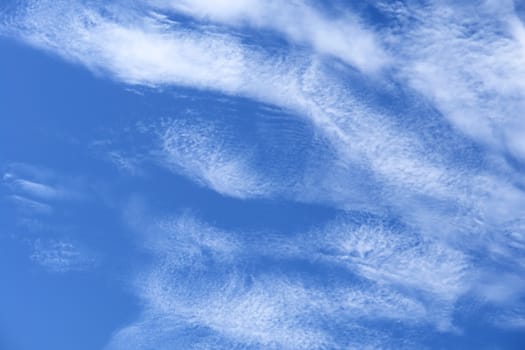 sunlight rays and clouds on the blue sky background