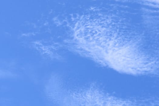 sunlight rays and clouds on the blue sky background