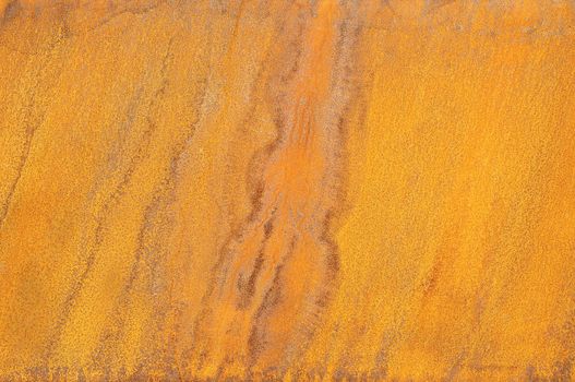 Orange Patterns on the Rusty Surface of the Metal