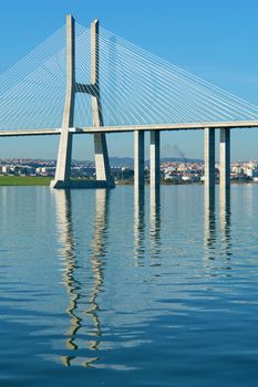 View from river Tagus of Lisbon's Nations park and "Vasco da Gama" Bridge, Portugal                           