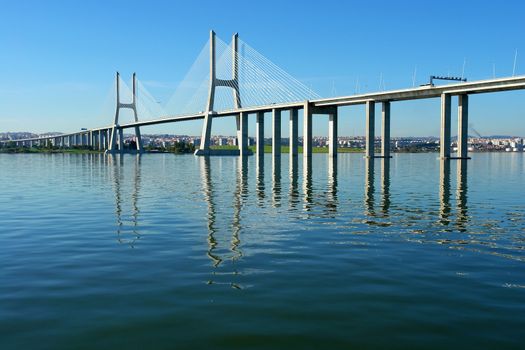 View from river Tagus of Lisbon's "Vasco da Gama" Bridge, Portugal                           