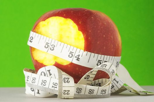 Diet Apple and Meter on a Colored Background 
