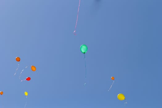 color balloons flying to the sky