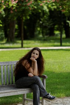 pretty young girl on a bench