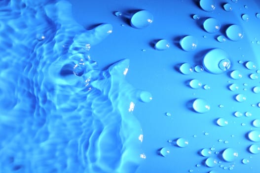 Some Water Drops on a Blue Textured Background