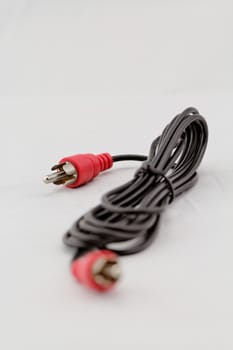 only red audio RCA cable on a white background (left)