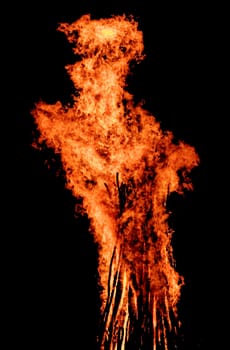 red flames of huge bonfire or campfire as black backgorund