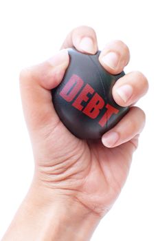 Hand squeezing a stress ball labeled with debt 
