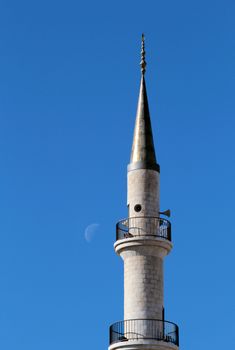 Madaba "jesuscristo" Mosque minaret in blue sky, moon in the background, Jordan