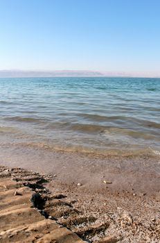 Dead Sea coastline, whit salt crystals and formations in the sand. Jordan