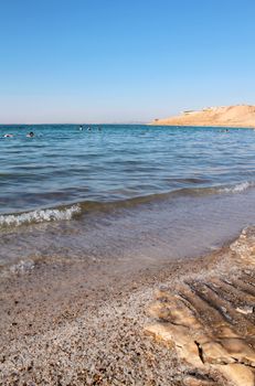 Dead Sea coastline, whit salt crystals and formations in the sand. Jordan
