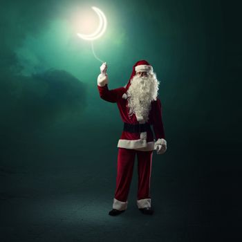 Santa Claus holding a string of luminous glowing moon