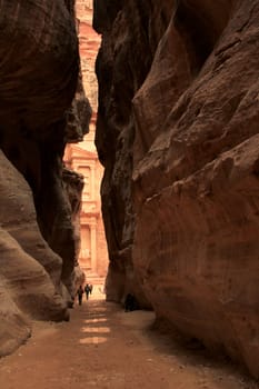 Rosy red walls of the Siq canyon, leading to the Treasury in Petra, Jordan.