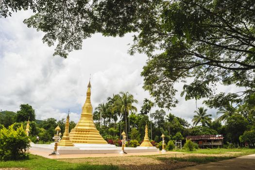 Golden pagoda mixed arts Thailand - Burma in in Thai temple Songkhla Buri, Kanchanaburi province, Thailand.
