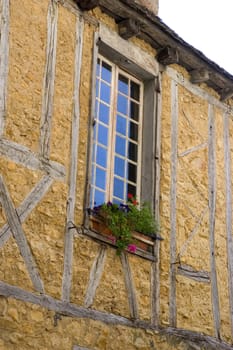 A window of an old building in the center of Sarlat