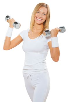 a fitness female holding two dumbbells and smiling