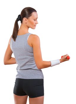 a sportswoman holding small dumbbell isolated