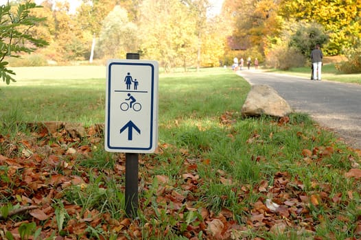 Footpath and bicycle path sign in park in Potsdam Germany