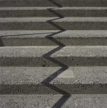 Zig zag shadow on a concrete starcase