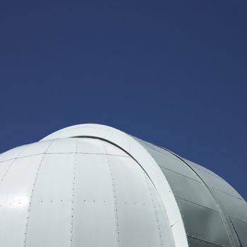 white observatory against the blue sky